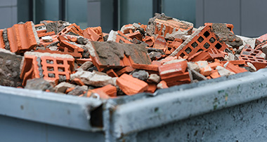 a container full of red bricks from building materials 