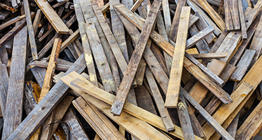 a pile of timber planks of different sizes and colours
